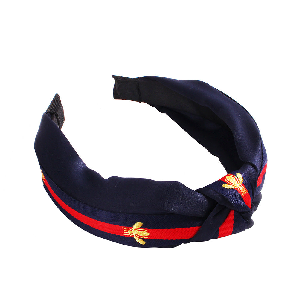 布面蜜蜂扭結髮箍－金色+紅黑帶款細節｜https://igowo.tw/