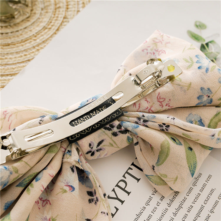 蝴蝶結碎花髮夾－黑色小碎花款細節｜https://igowo.tw/