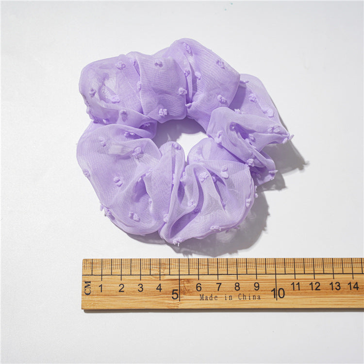 紫色雛菊大腸圈髮圈－四瓣花紫色款實拍｜https://igowo.tw/