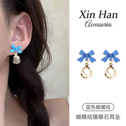 貓眼石蝴蝶結耳釘－商品主圖｜https://igowo.tw/