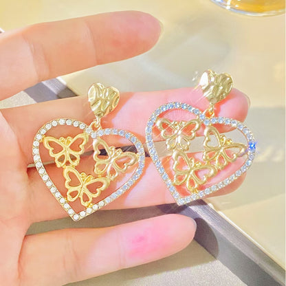 鋯石愛心蝴蝶鏤空耳環－商品主圖｜https://igowo.tw/