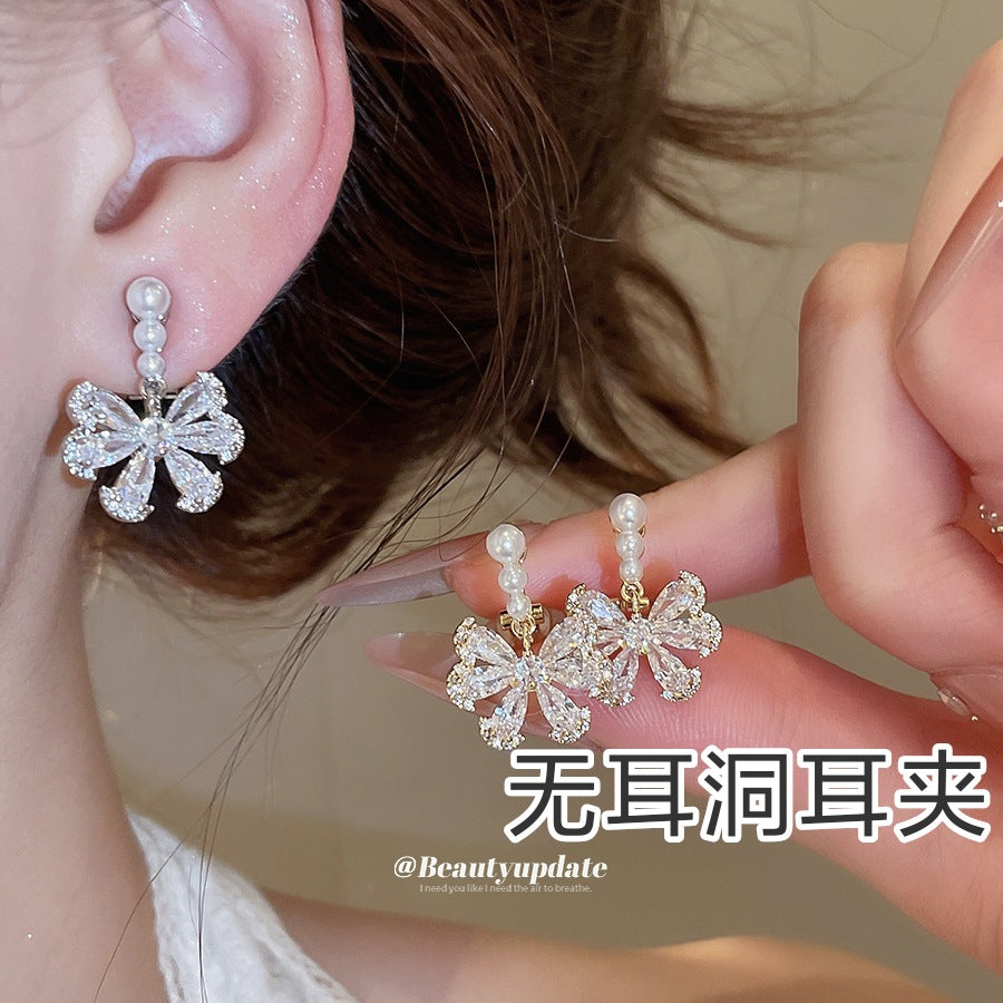 珍珠蝴蝶結免耳洞耳夾－商品主圖｜https://igowo.tw/