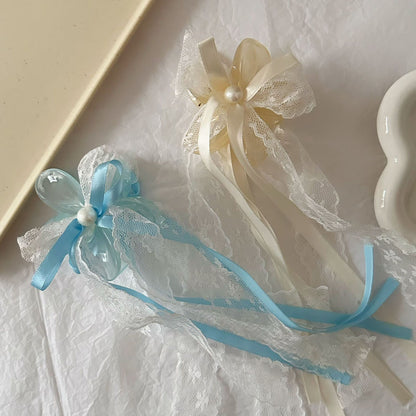 藍色網紗蝴蝶結鯊魚夾－白色花朵抓夾款實拍｜https://igowo.tw/