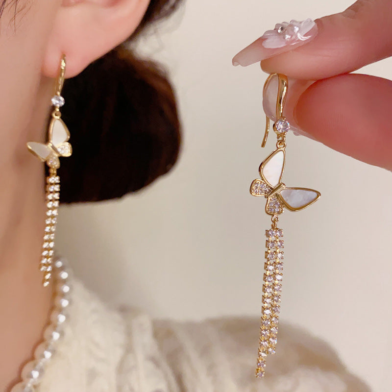 貝殼蝴蝶流蘇長版耳鉤－商品主圖｜https://igowo.tw/