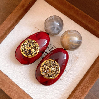 粉色樹脂橢圓垂墜耳釘－細節特寫70｜https://igowo.tw/