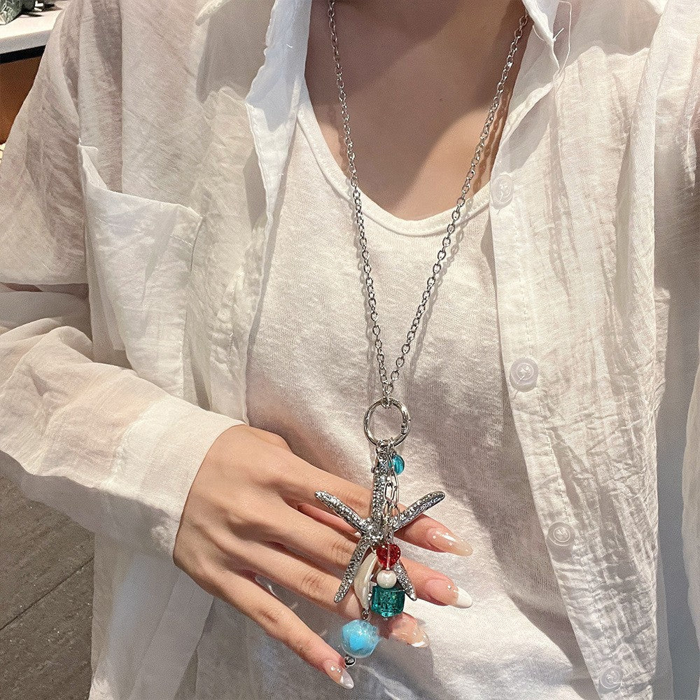彩色陶瓷海星編織項鍊－#項鍊-咖色-手持小貓款細節｜https://igowo.tw/
