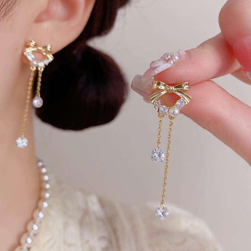 S925鋯石蝴蝶結流蘇耳墜－商品主圖｜https://igowo.tw/