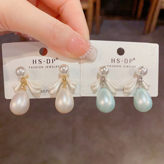 珍珠蝴蝶結簡約耳墜－商品主圖｜https://igowo.tw/