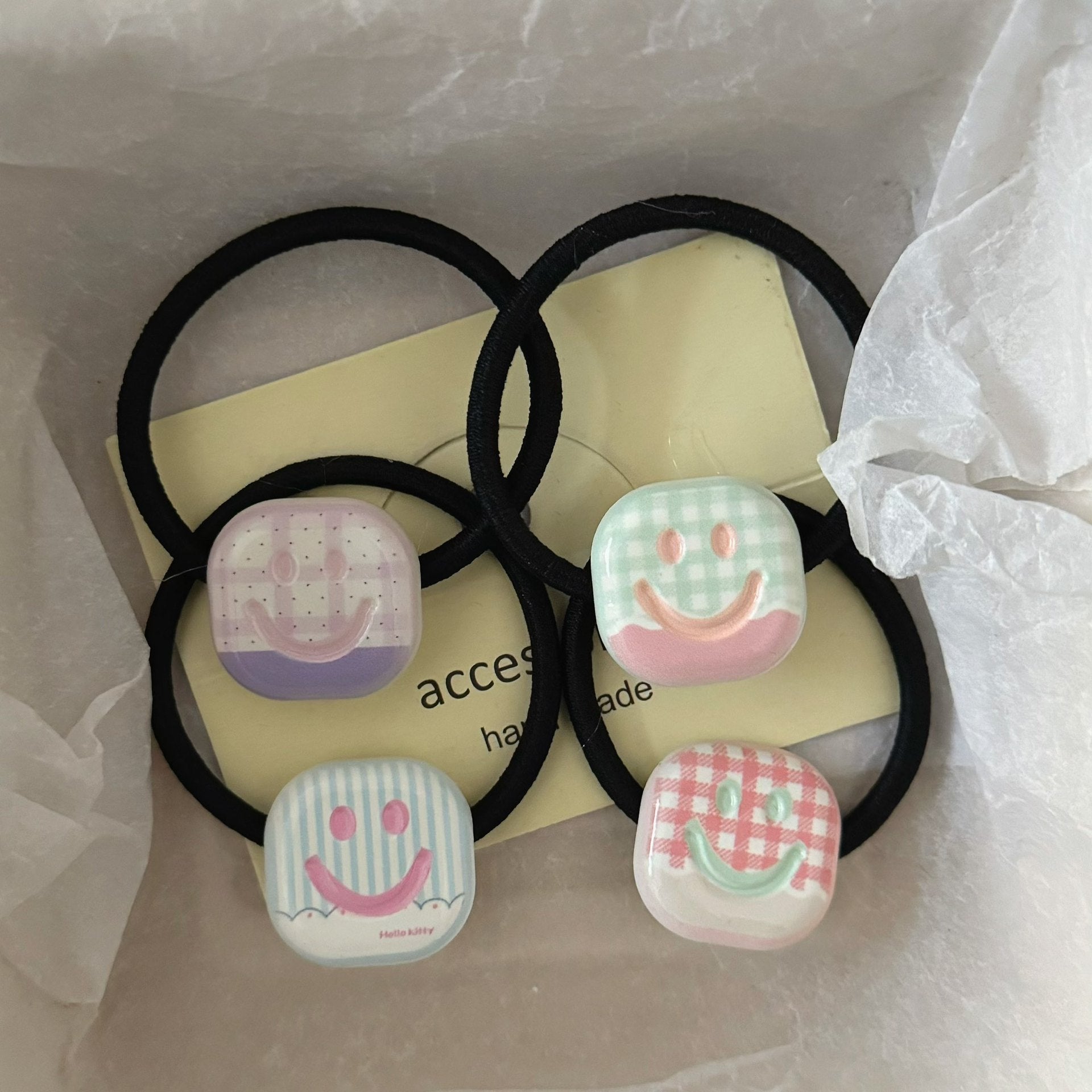 黑色笑臉方形髮圈－商品主圖｜https://igowo.tw/