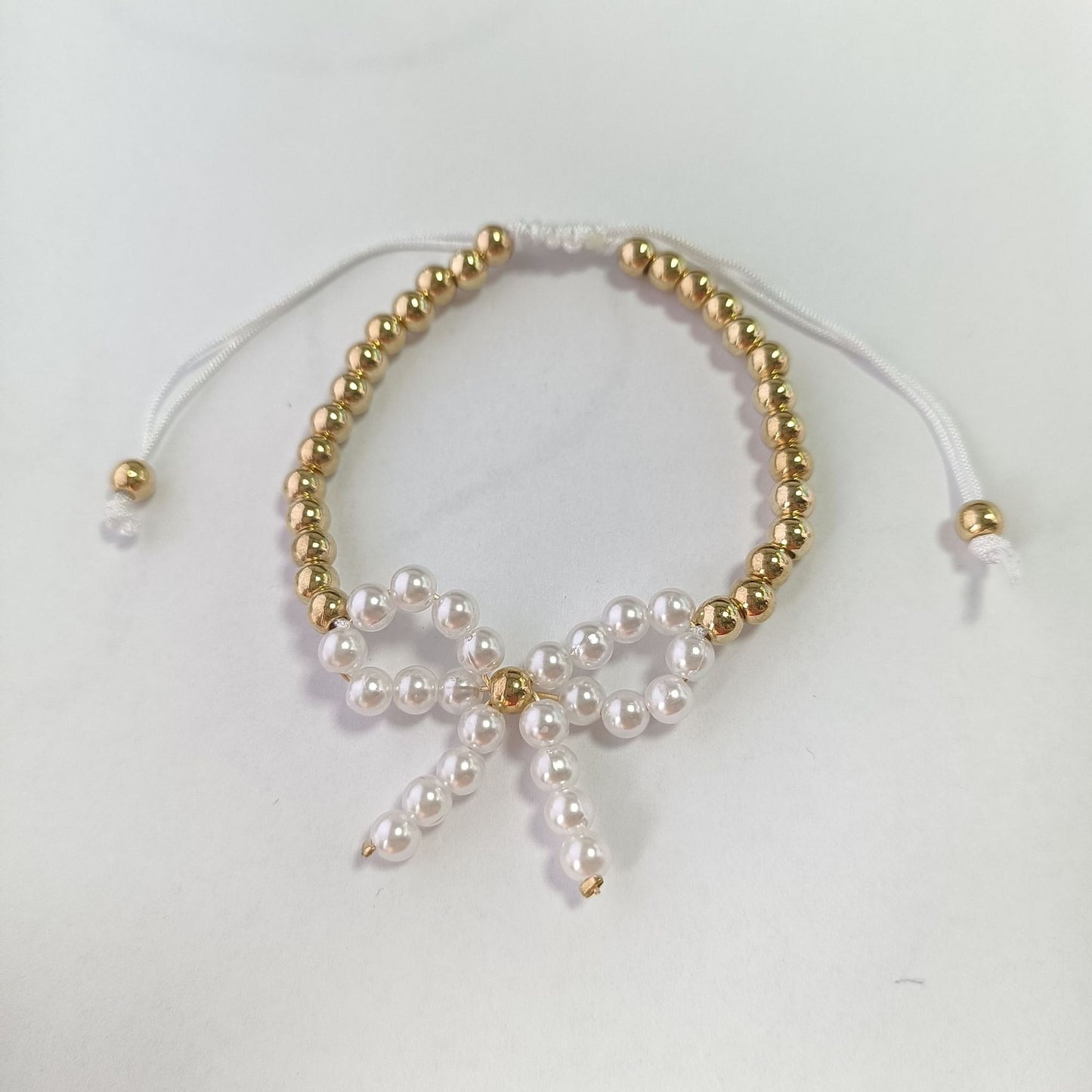 金色不鏽鋼蝴蝶結項鍊－細節特寫27｜https://igowo.tw/