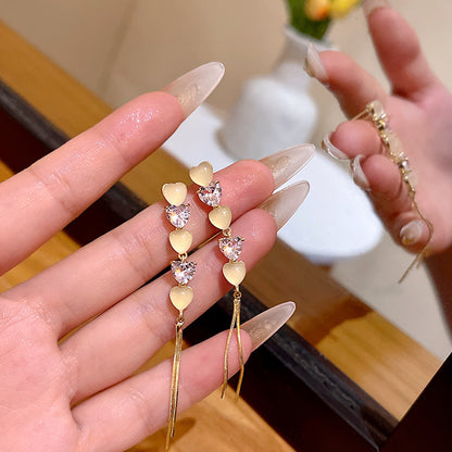 輕奢貓眼石愛心流蘇耳環