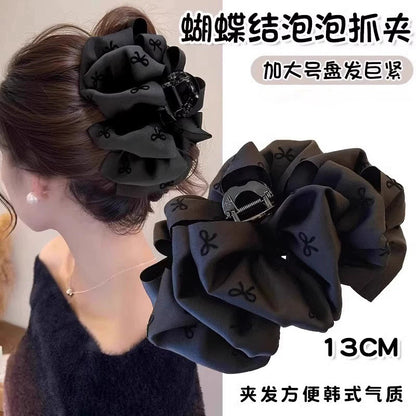 黑色蝴蝶結鯊魚夾－商品主圖｜https://igowo.tw/