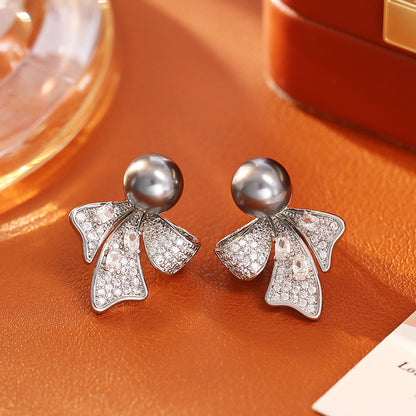 珍珠蝴蝶結兩用耳釘－第二視角實拍｜https://igowo.tw/