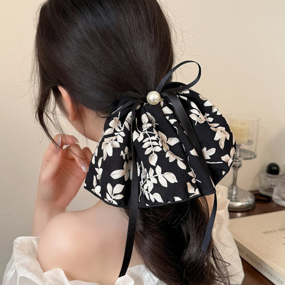 黑色緞帶蝴蝶結髮圈－商品主圖｜https://igowo.tw/
