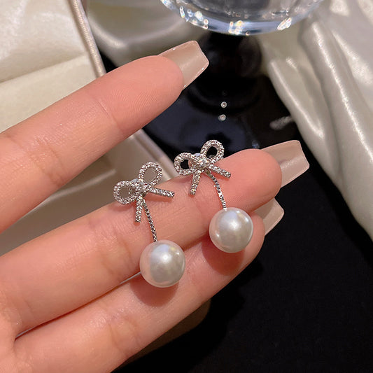 珍珠蝴蝶結流蘇耳環－商品主圖｜https://igowo.tw/