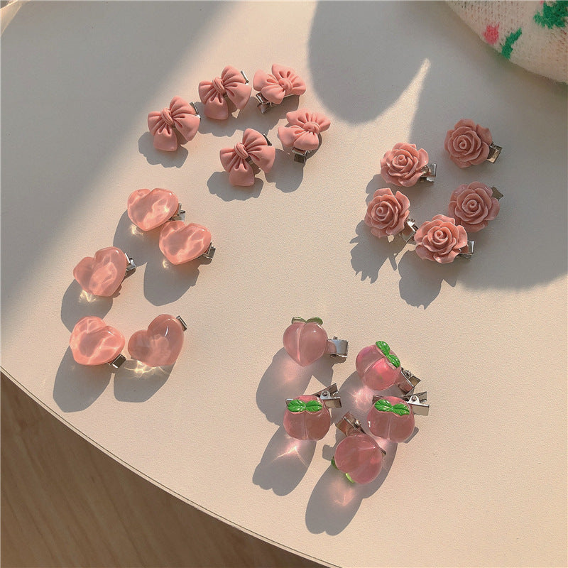 粉色蝴蝶結山茶花髮夾－水蜜桃（單個）款細節｜https://igowo.tw/