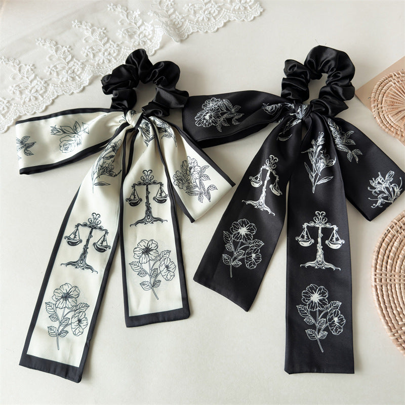 緞帶蝴蝶結花朵髮圈－商品主圖｜https://igowo.tw/