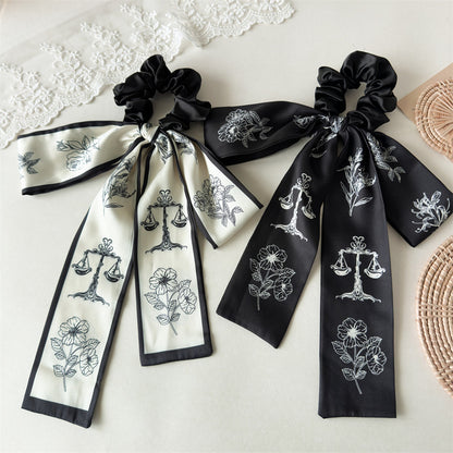 緞帶蝴蝶結花朵髮圈－商品主圖｜https://igowo.tw/
