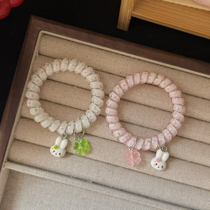粉色兔子花朵髮圈－商品主圖｜https://igowo.tw/