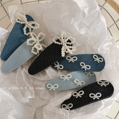 藍色珍珠蝴蝶結髮夾－商品主圖｜https://igowo.tw/