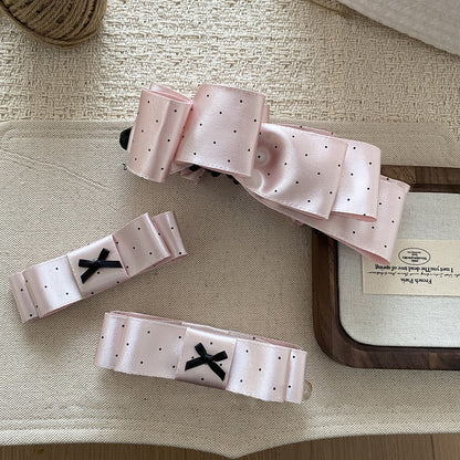 粉色波點蝴蝶結髮夾－商品主圖｜https://igowo.tw/
