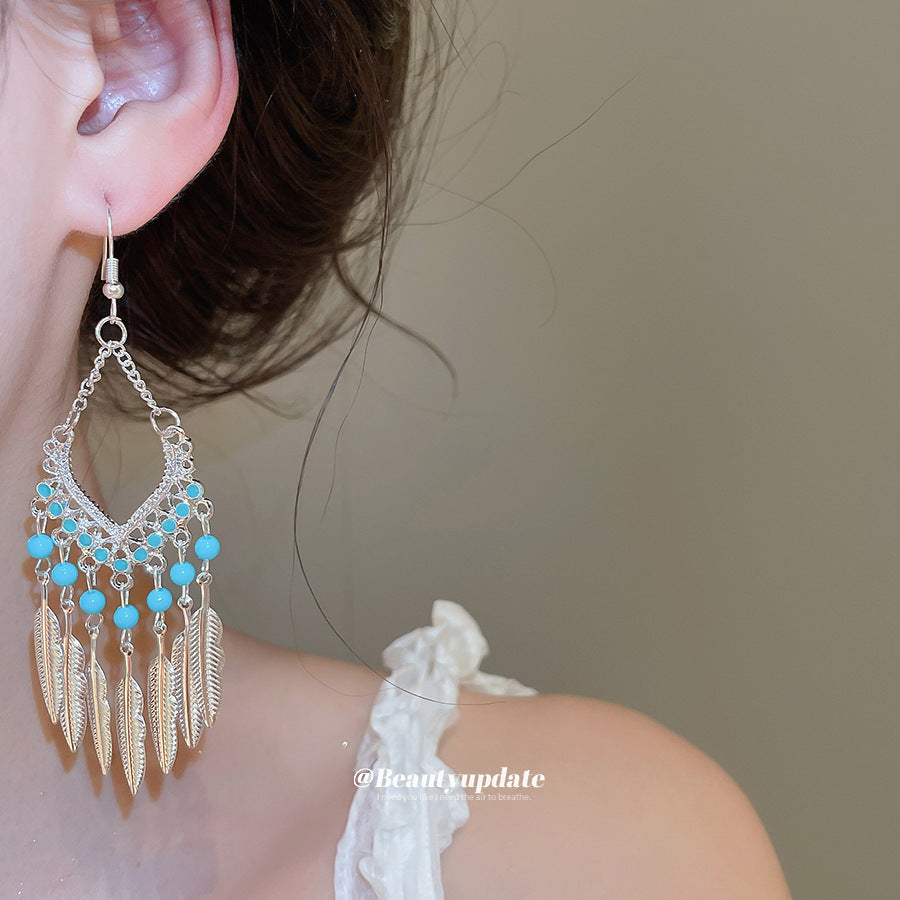 壓克力羽毛流蘇耳環－銀針-金色-紅色款細節｜https://igowo.tw/