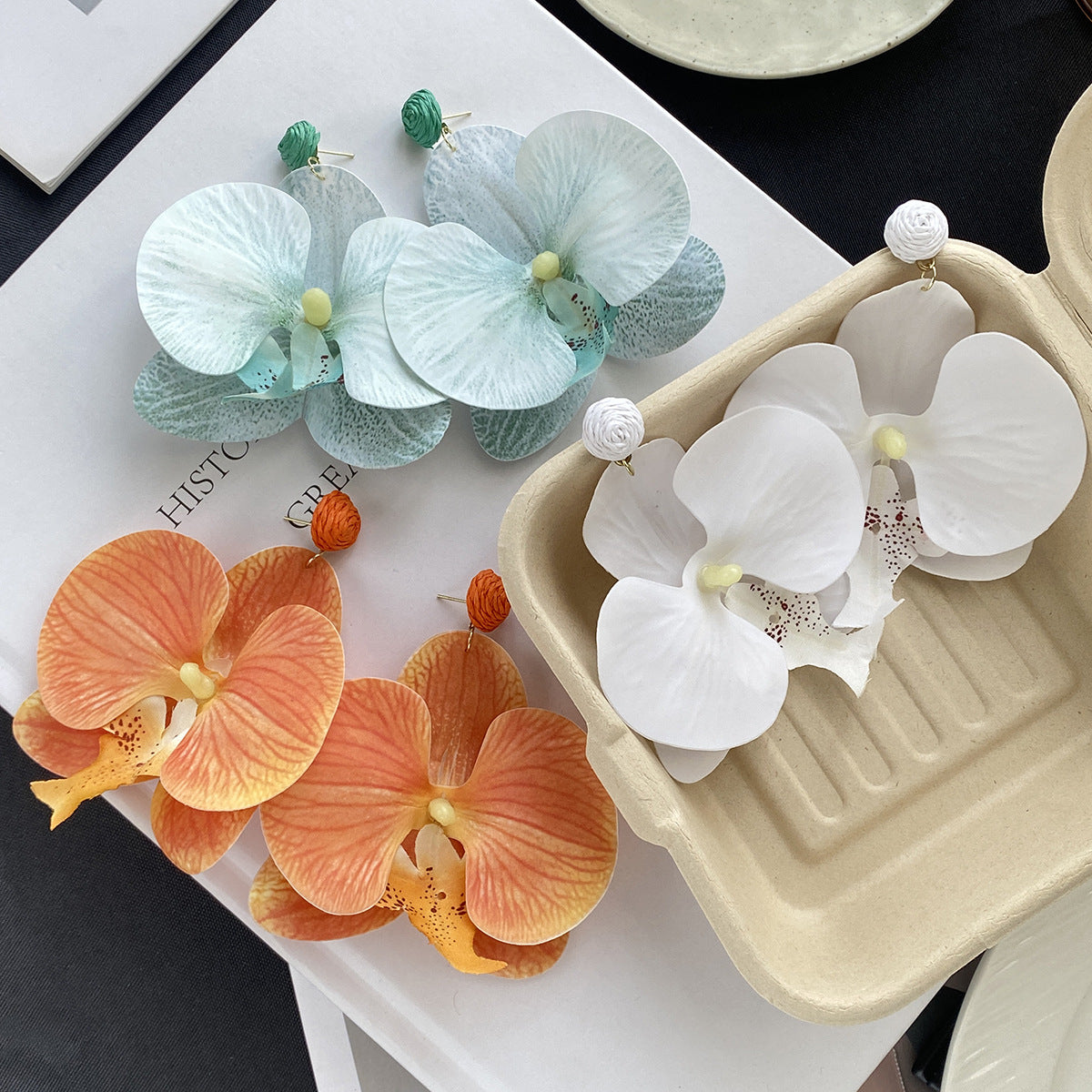 蝴蝶花朵誇張耳釘－商品主圖｜https://igowo.tw/
