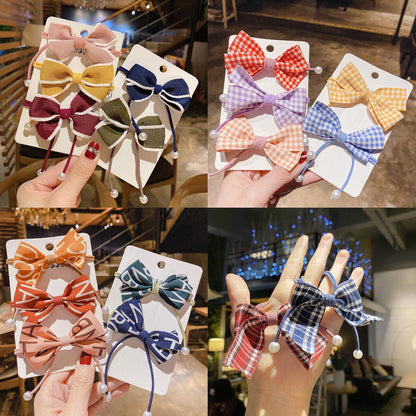 布面蝴蝶結髮圈－商品主圖｜https://igowo.tw/