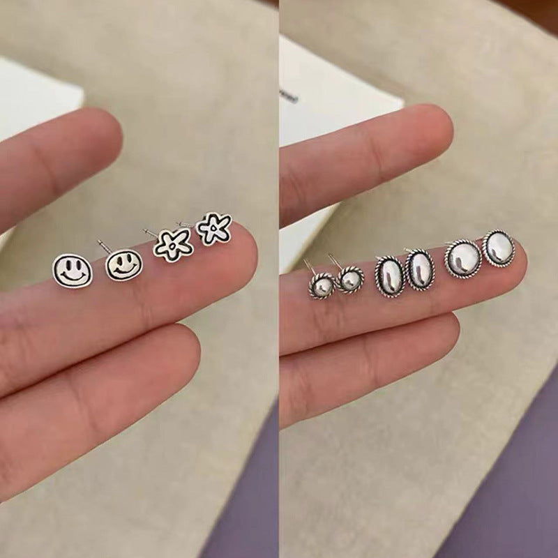S925笑臉花朵復古耳釘－商品主圖｜https://igowo.tw/
