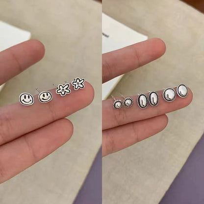 S925笑臉花朵復古耳釘－商品主圖｜https://igowo.tw/