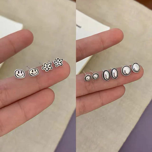 S925笑臉花朵復古耳釘－商品主圖｜https://igowo.tw/
