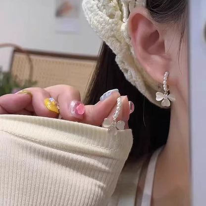 珍珠蝴蝶結圓圈耳環－商品主圖｜https://igowo.tw/