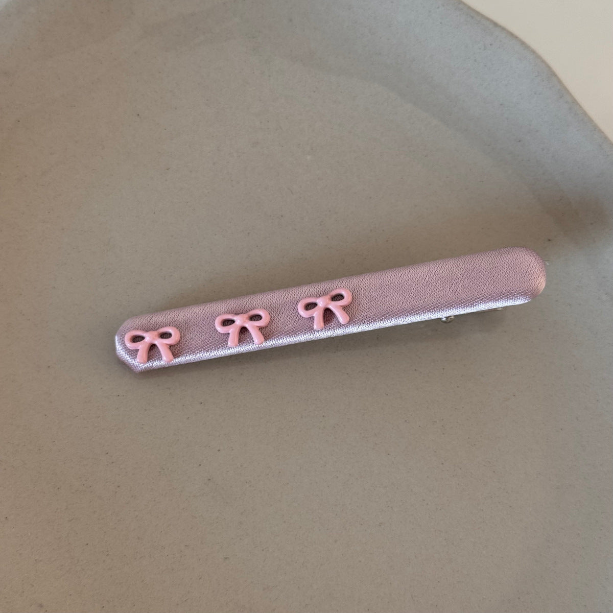 粉色布面蝴蝶結髮夾