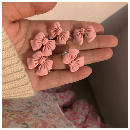 粉色蝴蝶結山茶花髮夾