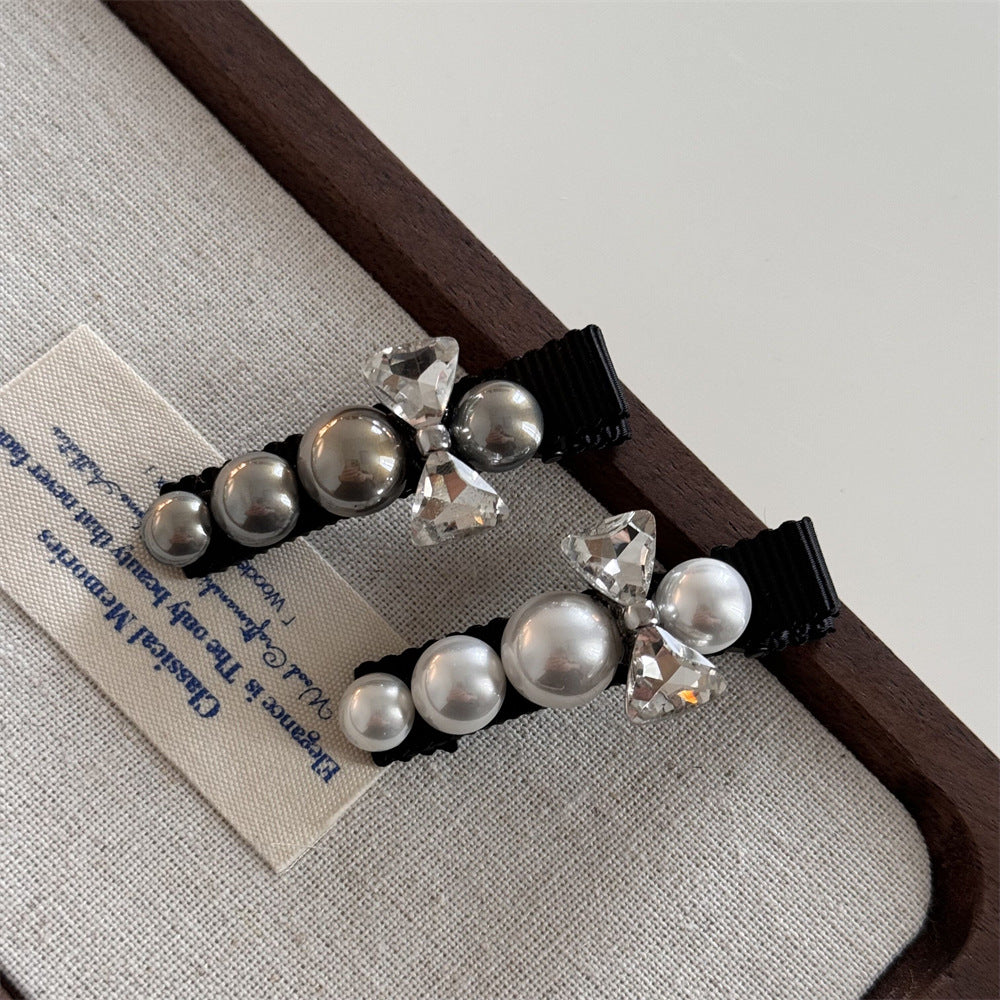 珍珠鋯石蝴蝶結髮夾－鑽結一字-灰珍珠款實拍｜https://igowo.tw/