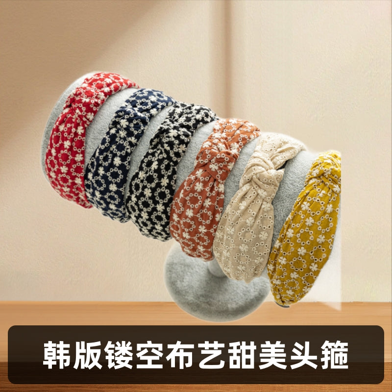 布面交叉扭結鏤空髮箍－商品主圖｜https://igowo.tw/