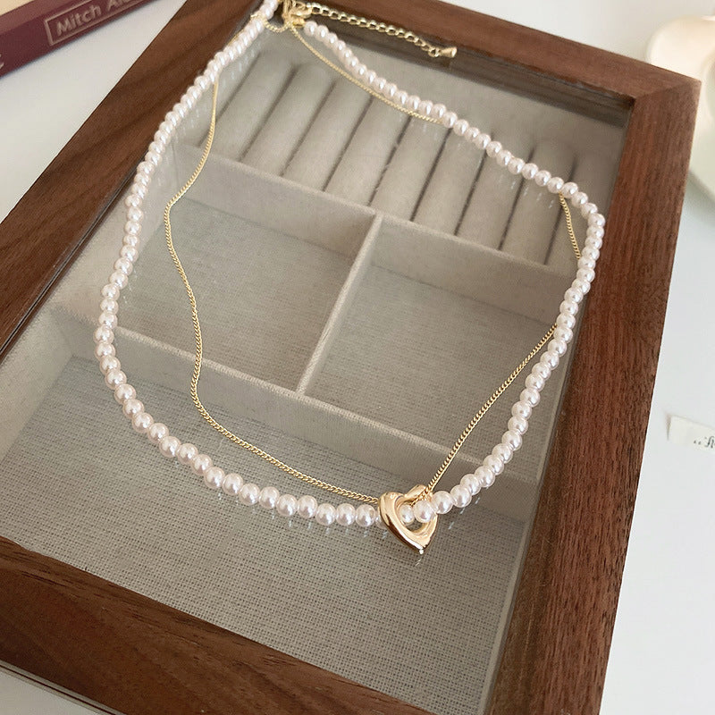 白色珍珠愛心鑲鑽耳環－細節特寫4｜https://igowo.tw/