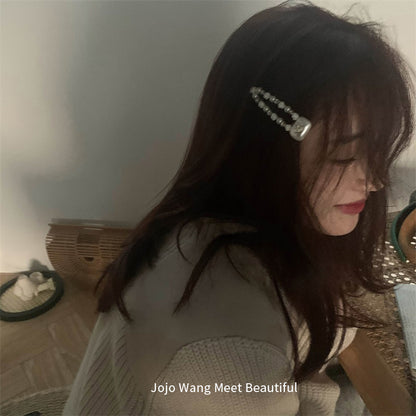 珍珠蝴蝶結簡約髮夾－愛心蝴蝶結款實拍｜https://igowo.tw/