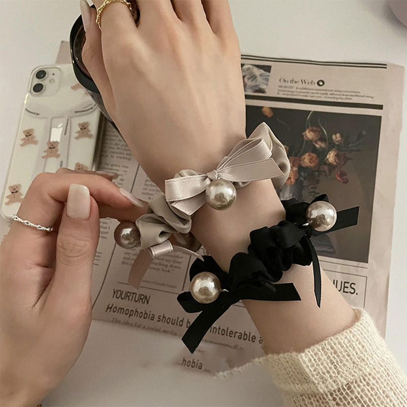 珍珠蝴蝶結髮圈－商品主圖｜https://igowo.tw/