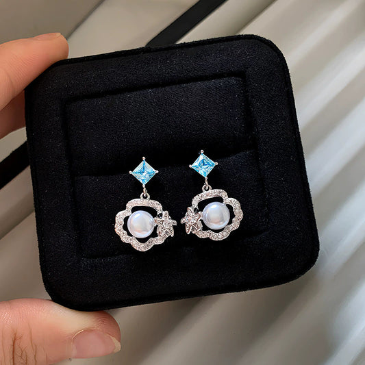 珍珠雲朵鏤空耳釘－商品主圖｜https://igowo.tw/