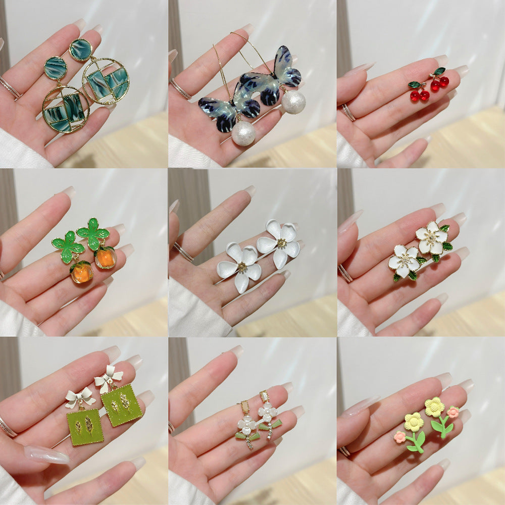 蝴蝶結花朵耳環－商品主圖｜https://igowo.tw/