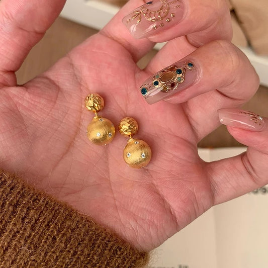 金色星星兩用拉絲耳釘－商品主圖｜https://igowo.tw/