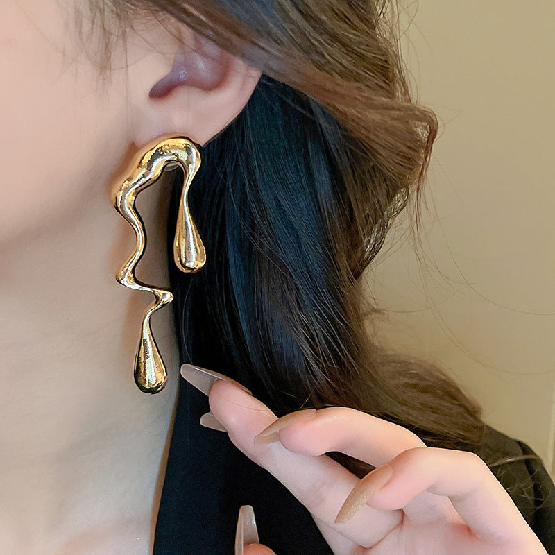 真金電鍍銀針鏤空花朵流蘇耳環歐美跨境小眾設計感耳釘耳飾批發女