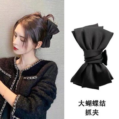 黑色蝴蝶結雙面鯊魚夾－商品主圖｜https://igowo.tw/