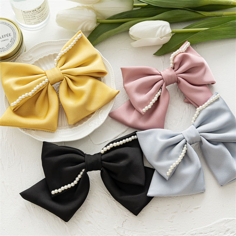 珍珠蝴蝶結髮夾－商品主圖｜https://igowo.tw/