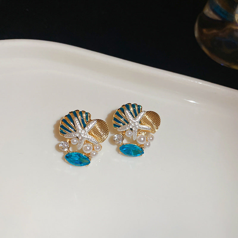 藍色銀針花朵鑲鑽耳釘－細節特寫13｜https://igowo.tw/