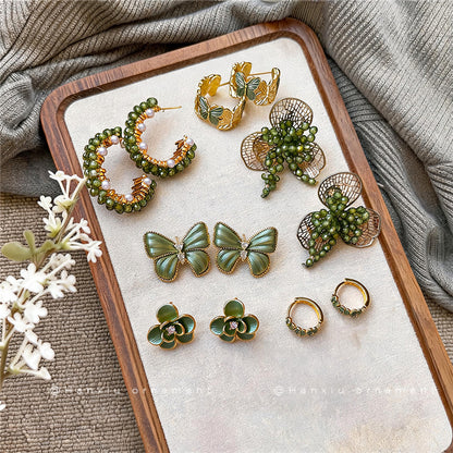 珍珠蝴蝶結花朵耳釘－第二視角實拍｜https://igowo.tw/