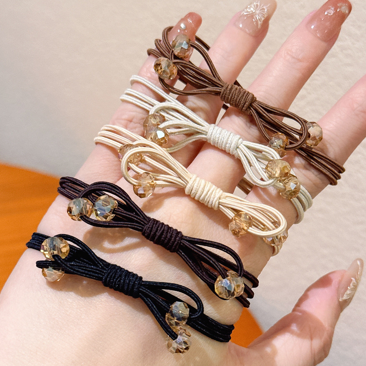 水晶蝴蝶結扭結髮圈－商品主圖｜https://igowo.tw/