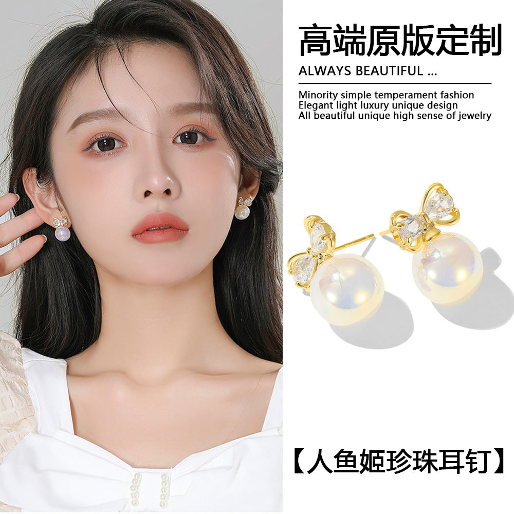 珍珠魚尾蝴蝶結耳釘－商品主圖｜https://igowo.tw/