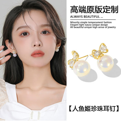 珍珠魚尾蝴蝶結耳釘－商品主圖｜https://igowo.tw/
